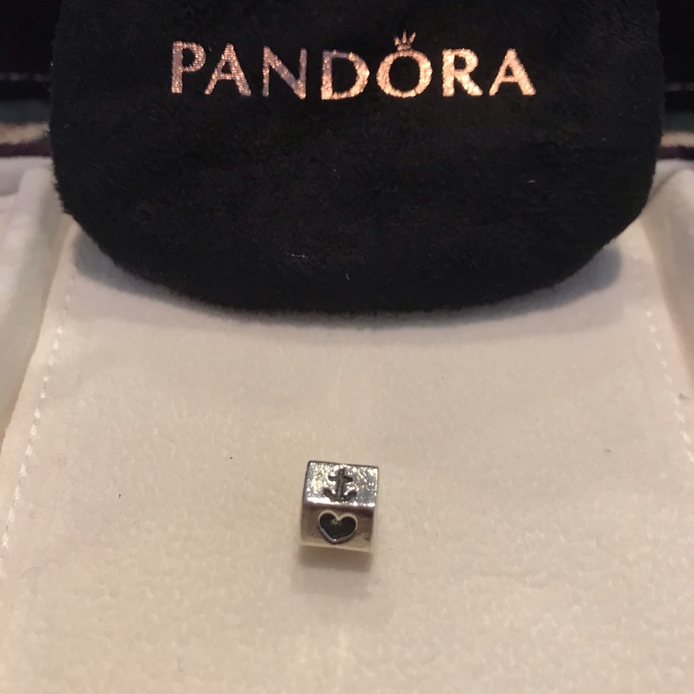 Authentic Pandora. Retired Cross/heart/anchor.